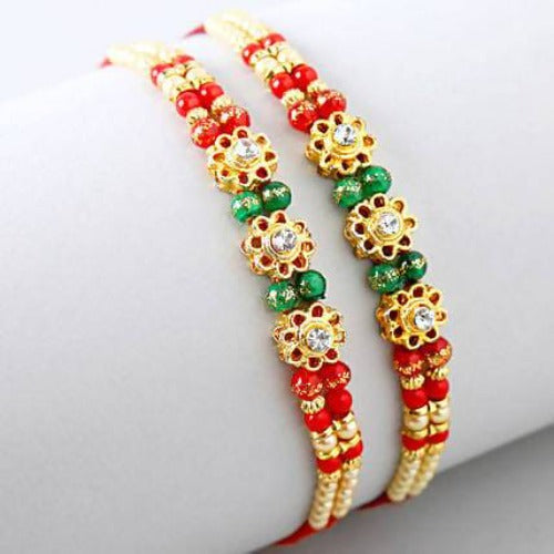 Set of 2 Charming Beads Rakhi and Dairy Milk Fruit N Nut Chocolates Combo