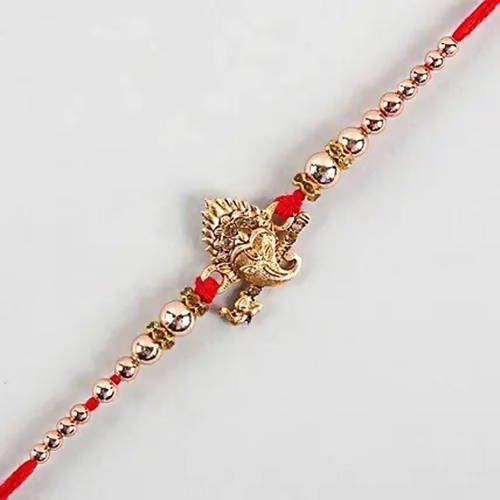 Auspicious Ganesha Rakhi And Almonds Jar