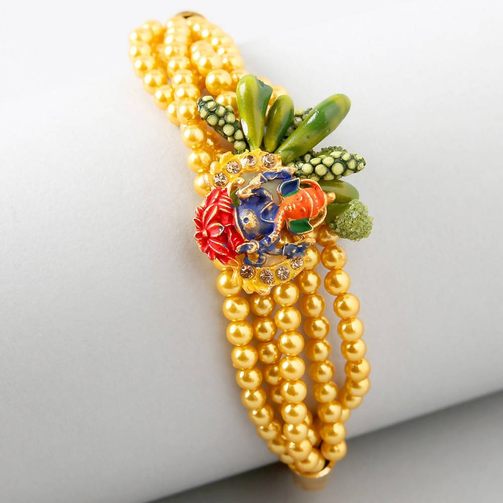 Vibrant Ganesha Rakhi & Cadbury Fruit N Nut Chocolates