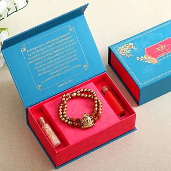 Om Pearl Bracelet Rakhi & Kaju Katli Box
