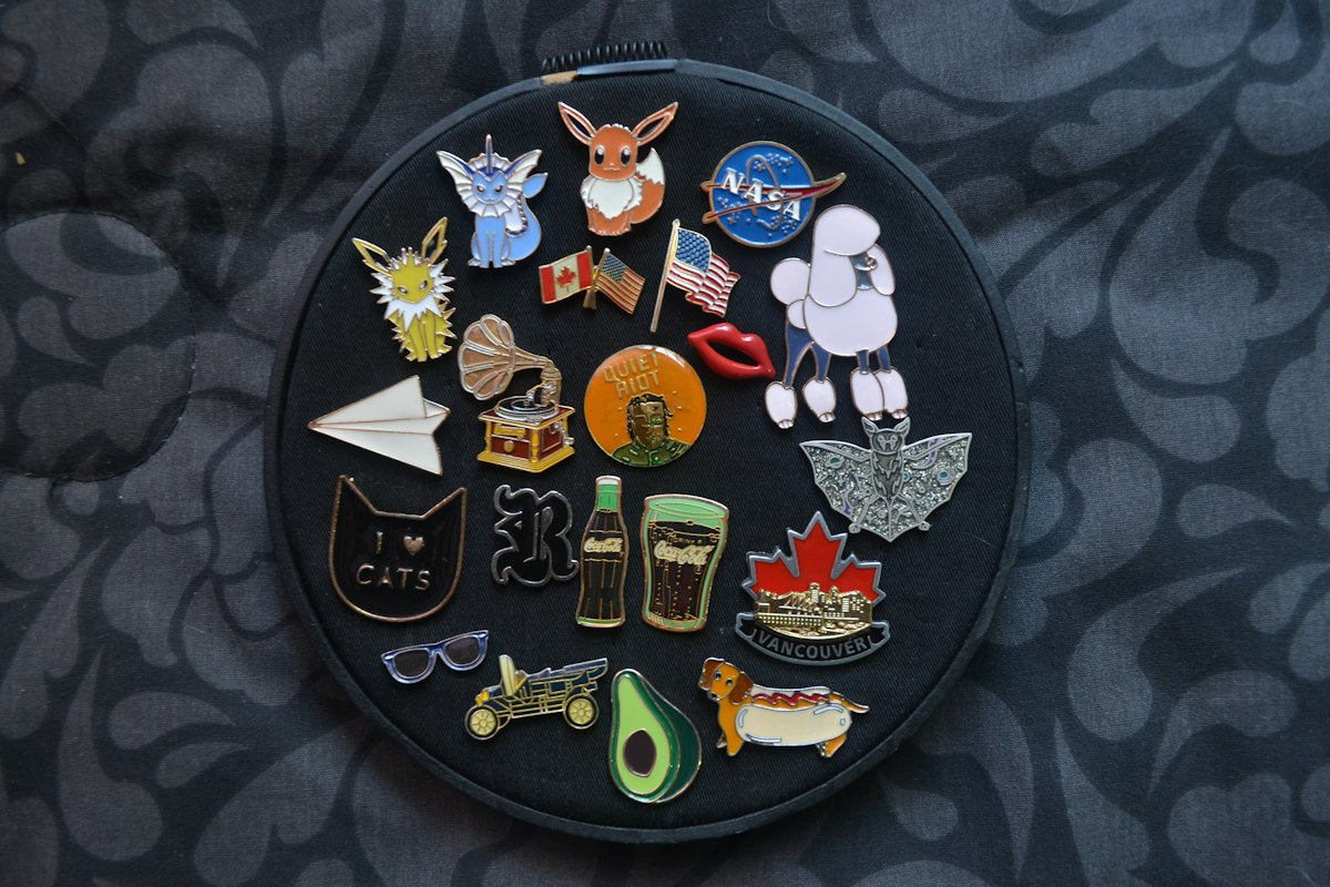 Assorted colorful pins and badges collection