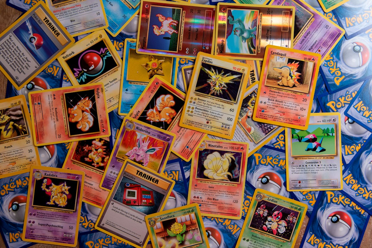 Colorful trading cards scattered on flat surface