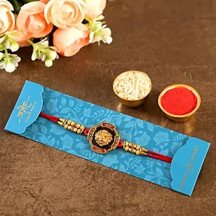 Traditional Lion Face Rakhi & Kaju Roll Box